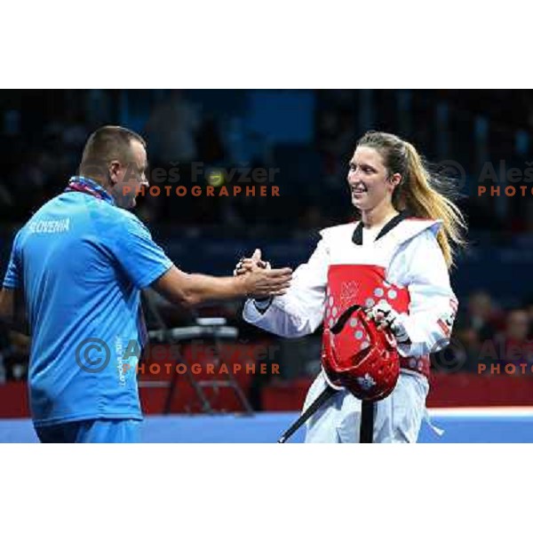 Coach Dusan Pantar congratulates Franka Anic of Slovenia after vicroty over Aitmukhambetova of Kazakhstan in Preliminary round of women\'s -67 kg taekwondo tournament in ExCel during London 2012 Summer Olympic Games, Great Britain on August 10, 2012 