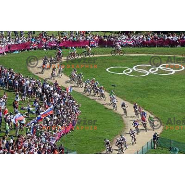 Blaza Klemencic and Tanja Zakelj of Slovenia in action during women\'s cross country race at Hadleigh farm near Southend-on-Sea during London 2012 Summer Olympic Games, Great Britain on August 11, 2012 