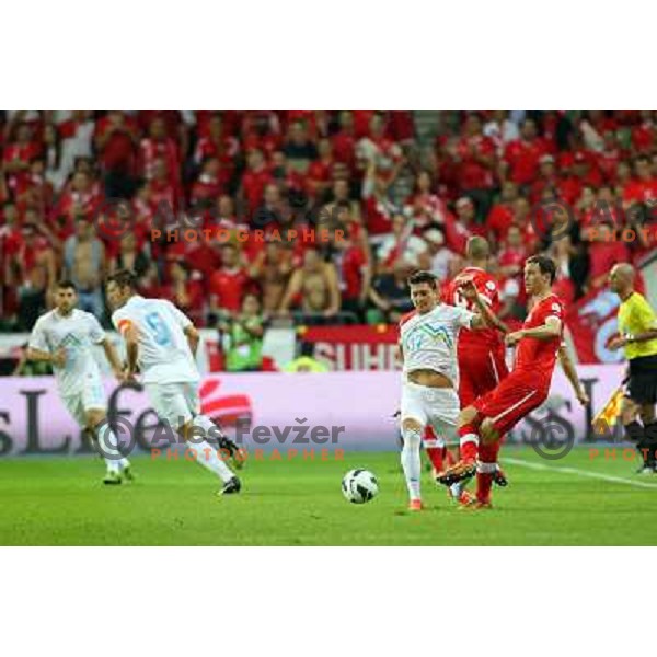 of Slovenia and of Switzerland in action during football match Slovenia-Switzerland in Qualification group E of 2014 FIFA World Cup Brasil, played in Arena Stozice, Ljubljana, Slovenia on September 7, 2012 