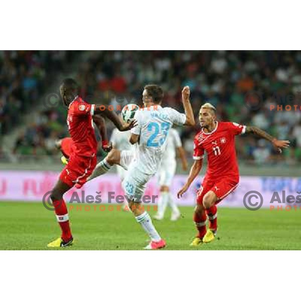 of Slovenia and of Switzerland in action during football match Slovenia-Switzerland in Qualification group E of 2014 FIFA World Cup Brasil, played in Arena Stozice, Ljubljana, Slovenia on September 7, 2012 