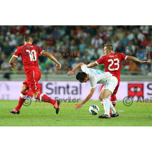 Xherdan Shaqiri of Switzerland and Armin Bacinovic of Slovenia in action during football match Slovenia-Switzerland for FIFA 2014 World Cup Brasil Qualifiers, played in Arena Stozice, Ljubljana, Slovenia on September 7, 2012 