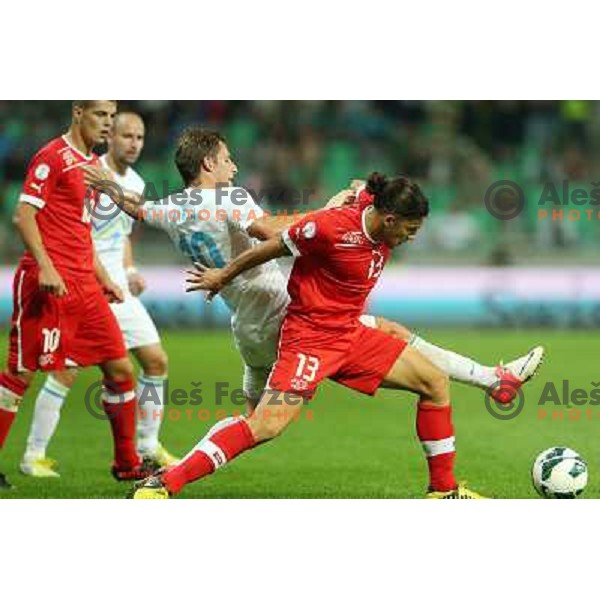 Valter Birsa of Slovenia and Ricardo Rodriguez in action during football match Slovenia-Switzerland for FIFA 2014 World Cup Brasil Qualifiers, played in Arena Stozice, Ljubljana, Slovenia on September 7, 2012 