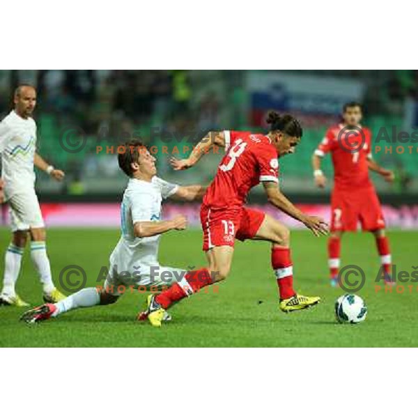 Valter Birsa of Slovenia and Ricardo Rodriguez in action during football match Slovenia-Switzerland for FIFA 2014 World Cup Brasil Qualifiers, played in Arena Stozice, Ljubljana, Slovenia on September 7, 2012 