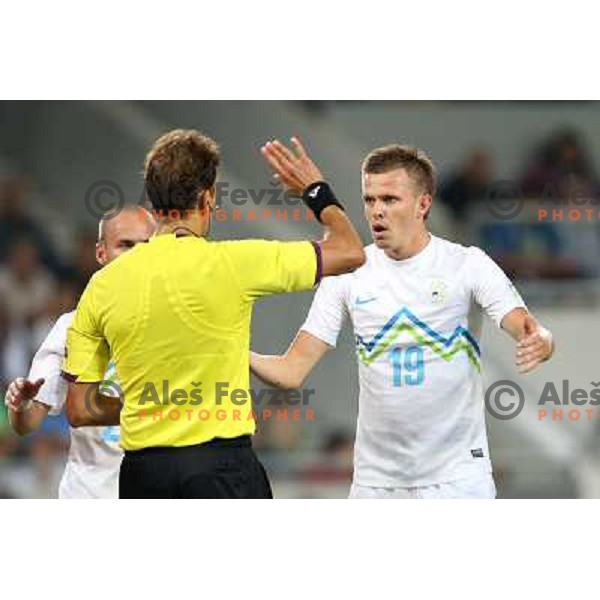 Referee Paolo Tagliavento shows by mistake red card and than yellow card to Josip Ilicic of Slovenia during football match Slovenia-Switzerland for FIFA 2014 World Cup Brasil Qualifiers, played in Arena Stozice, Ljubljana, Slovenia on September 7, 2012 