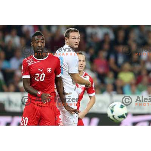 Johan Djourou and Tim Matavz of Slovenia during football match Slovenia-Switzerland for FIFA 2014 World Cup Brasil Qualifiers, played in Arena Stozice, Ljubljana, Slovenia on September 7, 2012 