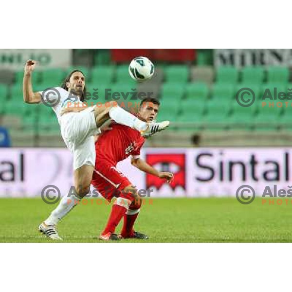 Marko Suler of Slovenia and Granit Xhaka during football match Slovenia-Switzerland for FIFA 2014 World Cup Brasil Qualifiers, played in Arena Stozice, Ljubljana, Slovenia on September 7, 2012 