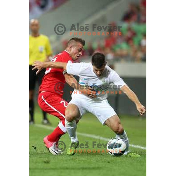 Xherdan Shaqiri of Switzerland and Bojan Jokic of Slovenia in action during football match Slovenia-Switzerland for FIFA 2014 World Cup Brasil Qualifiers, played in Arena Stozice, Ljubljana, Slovenia on September 7, 2012 