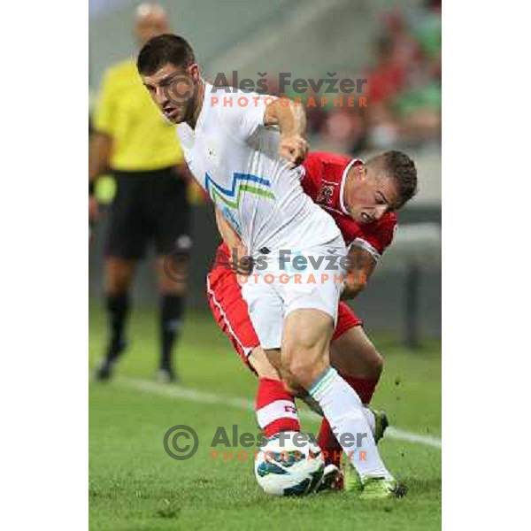 Xherdan Shaqiri of Switzerland and Bojan Jokic of Slovenia in action during football match Slovenia-Switzerland for FIFA 2014 World Cup Brasil Qualifiers, played in Arena Stozice, Ljubljana, Slovenia on September 7, 2012 