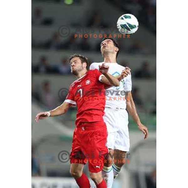 Tranquillo Barnetta and Aleksander Radosavljevic of Slovenia during football match Slovenia-Switzerland for FIFA 2014 World Cup Brasil Qualifiers, played in Arena Stozice, Ljubljana, Slovenia on September 7, 2012 