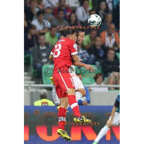 Zlatan Ljubijankic of Slovenia and Ricardo Rodriguez in action during football match Slovenia-Switzerland for FIFA 2014 World Cup Brasil Qualifiers, played in Arena Stozice, Ljubljana, Slovenia on September 7, 2012 