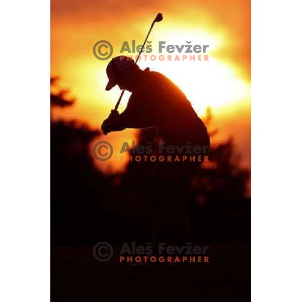 Golf Player hitting iron from the fairway on Arboretum golf course, Slovenia on September 16, 2012 