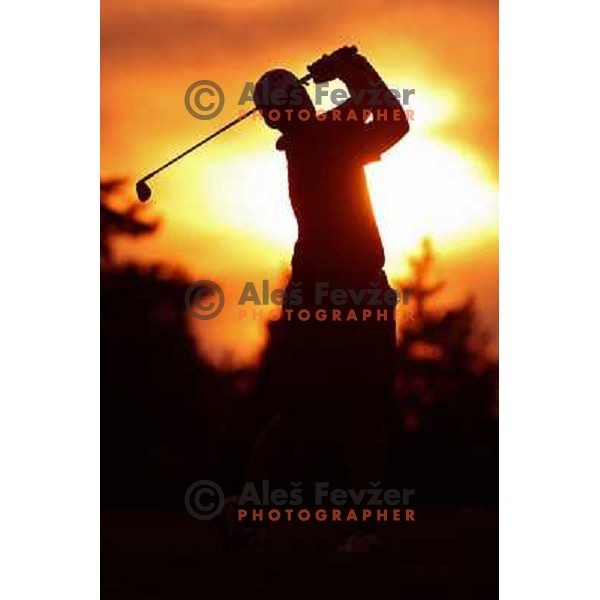 Golf Player hitting iron from the fairway on Arboretum golf course, Slovenia on September 16, 2012 