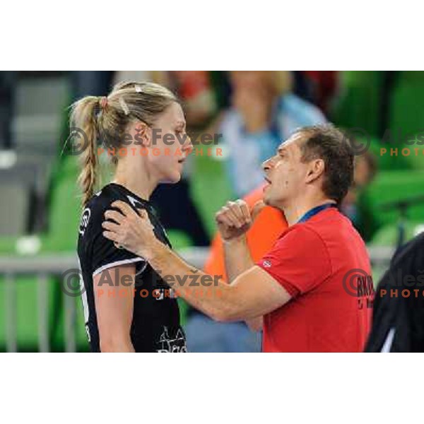Susann Muller and Tone Tiselj of Krim in action during handball match Krim Mercator - U Jolidon Cluj in EHF Champions league, played at Stozice Arena, Ljubljana, Slovenia on October 14, 2012 