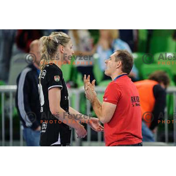 Susann Muller and Tone Tiselj of Krim in action during handball match Krim Mercator - U Jolidon Cluj in EHF Champions league, played at Stozice Arena, Ljubljana, Slovenia on October 14, 2012 