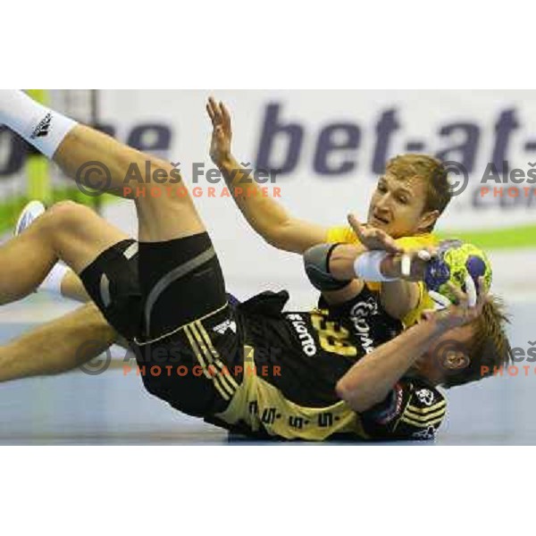 Ziga Mlakar of Celje and Filip Jicha of THW Kiel in action during handball match RK Celje Pivovarna Lasko-THW Kiel in EHF men\'s Champions league, played in Arena Zlatorog in Celje, Slovenia on November 17, 2012 