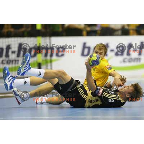 Ziga Mlakar of Celje and Filip Jicha of THW Kiel in action during handball match RK Celje Pivovarna Lasko-THW Kiel in EHF men\'s Champions league, played in Arena Zlatorog in Celje, Slovenia on November 17, 2012 
