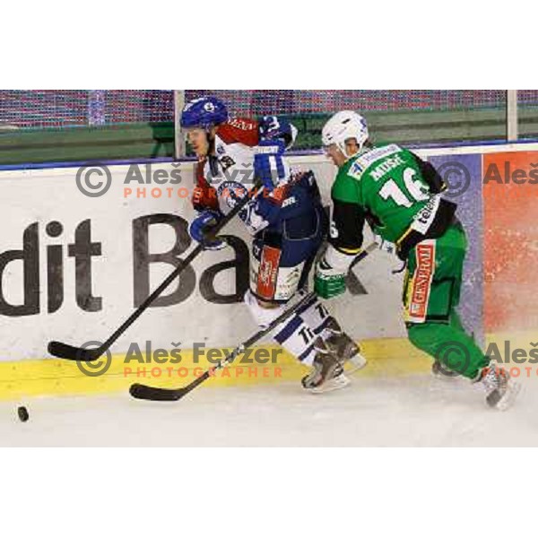 Ales Music of Telemach Olimpija and Sasa Martinovic of Medvescak Zagreb in action during ice hockey match Telemach Olimpija Ljubljana- KHL Medvescak Zagreb in round 28 of Ebel league 2012/13 played in Hala Tivoli, Ljubljana, Slovenia on December 7th , 201