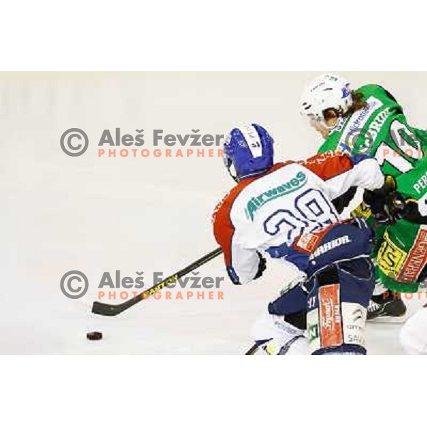 Brock Mc Bride of Telemach Olimpija and Alan Letang of Medvescak Zagreb in action during ice hockey match Telemach Olimpija Ljubljana- KHL Medvescak Zagreb in round 28 of Ebel league 2012/13 played in Hala Tivoli, Ljubljana, Slovenia on December 7th , 201