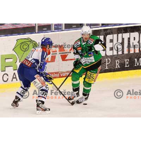 Matevz Erman of Telemach Olimpija and Tomislav Zanoski of Medvescak Zagreb in action during ice hockey match Telemach Olimpija Ljubljana- KHL Medvescak Zagreb in round 28 of Ebel league 2012/13 played in Hala Tivoli, Ljubljana, Slovenia on December 7th , 