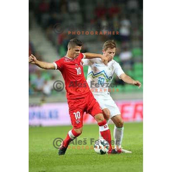 Vlater Birsa of Slovenia and Granit Xhaka of Switzerland during football match Slovenia-Switzerland in group E in FIFA 2014 World Cup Brasil Qualifiers, played in Arena Stozice, Ljubljana, Slovenia on September 7, 2012 