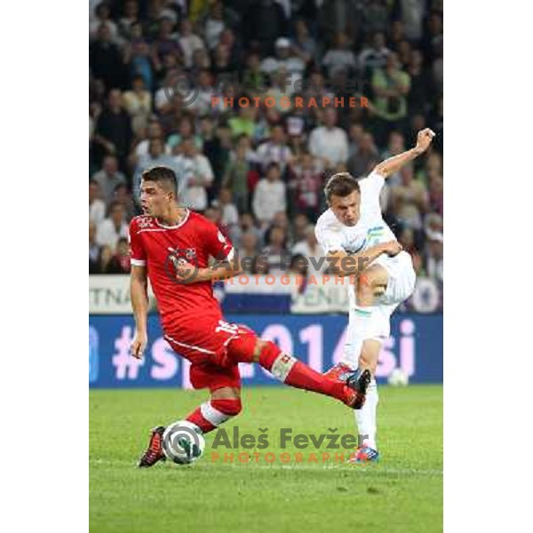Zlatko Dedic of Slovenia and Granit Xhaka of Switzerland during football match Slovenia-Switzerland in group E in FIFA 2014 World Cup Brasil Qualifiers, played in Arena Stozice, Ljubljana, Slovenia on September 7, 2012 