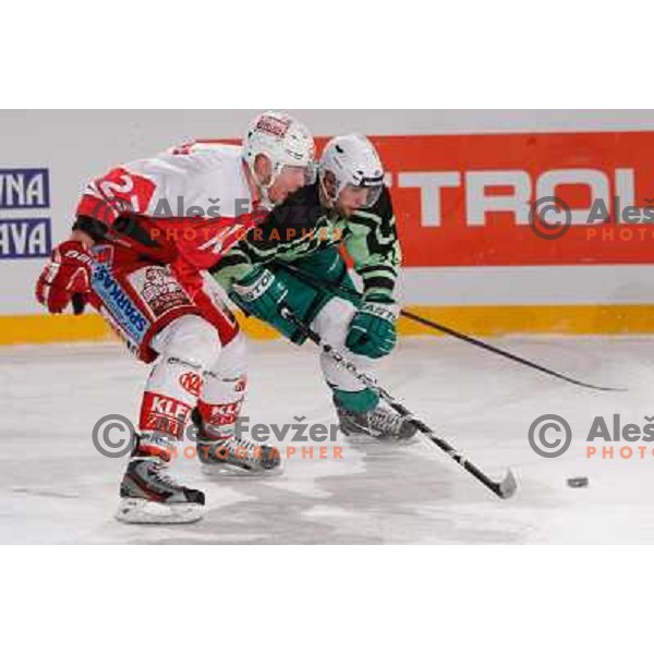 Ziga Pance of Telemach Olimpija and Michael Siklenka of KAC Celovec in action during Icefest 2013 open-air hockey match played on Joze Plecnik Bezigrad stadion in Ljubljana, Slovenia on January 8th, 2013 
