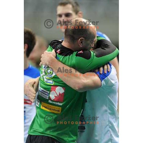 Gorazd skof and Players of Slovenia celebrate victory 28-27 in eight-final match between Slovenia and Russia at Handball World Championships 2013 in Barcelona, Spain on January 23, 2013 