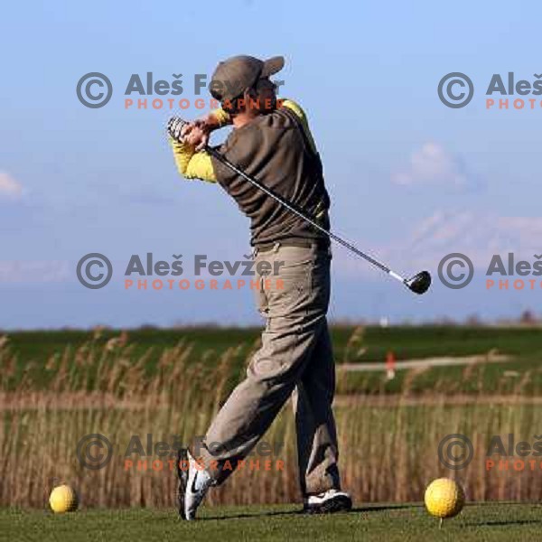 Teeing off at 17th hole at Grado golf course, Italy