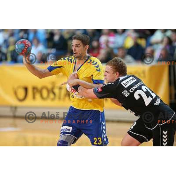 Nikola Manojlovic of Cimos Koper and Matej Gaber of RK Gorenje Velenje in action during handball match Cimos Koper-Gorenje Velenje in round 8 of 1.NLB leasing league 2012/13, played in Bonifika Hall, Koper, Slovenia on October 27, 2012 