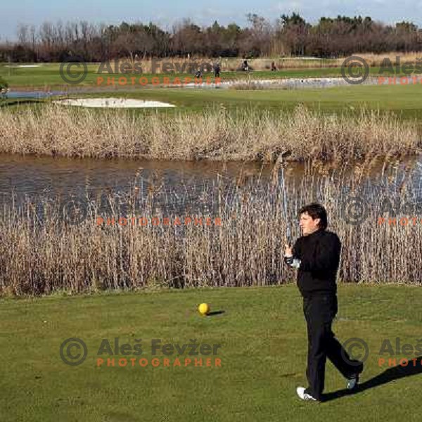 Teeing off at 13th hole at Grado golf course, Italy