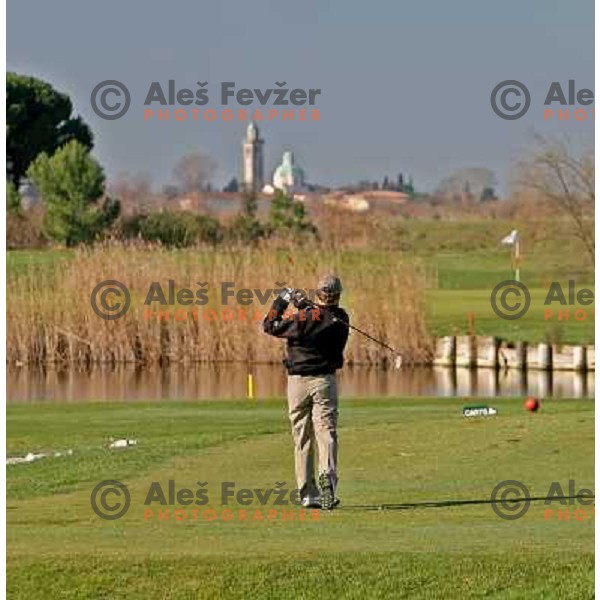 Teeing off at first hole at Grado golf course, Italy