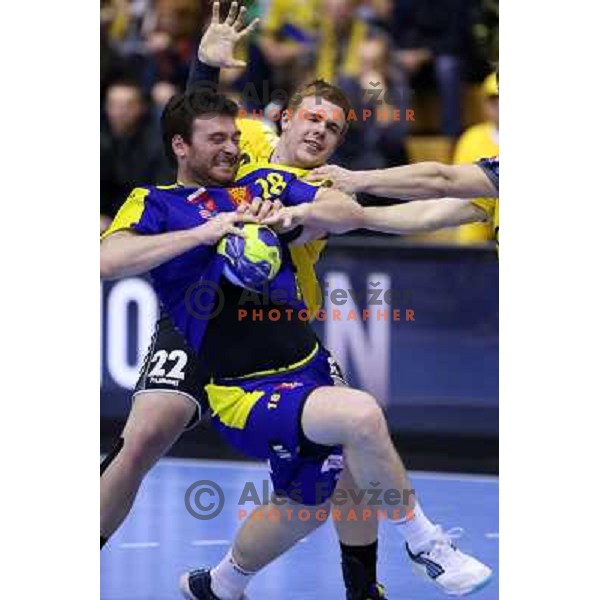 Rastko Stojkovic of Vive targi Kielce and Matej Gaber of RK Gorenje Velenje in action during handball match RK Gorenje Velenje-KS Vive Targi Kielce in EHF Velux Champions league, played in Red Hall, Velenje, Slovenia on February 23, 2013 