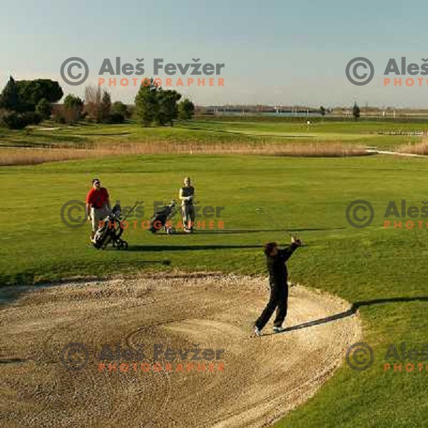 playing 18th hole at Grado golf course, Italy