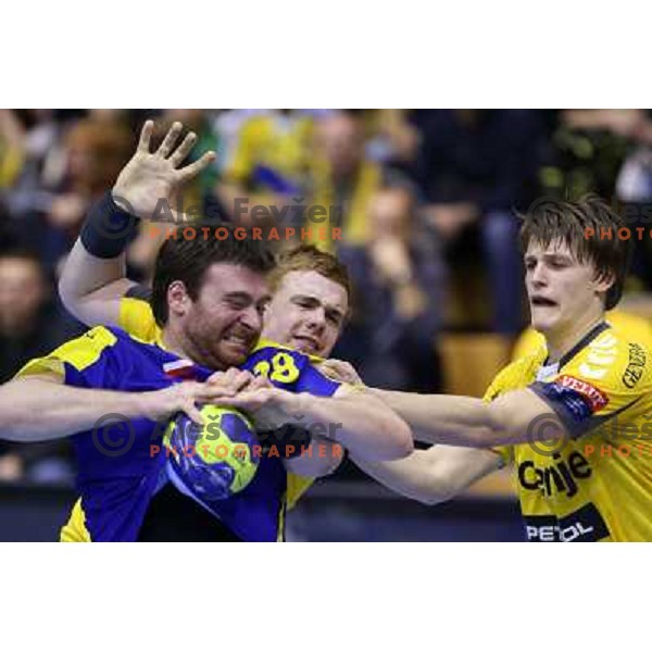 Rastko Stojkovic of Vive targi Kielce and Matej Gaber,Jure Dolenec of RK Gorenje Velenje in action during handball match RK Gorenje Velenje-KS Vive Targi Kielce in EHF Velux Champions league, played in Red Hall, Velenje, Slovenia on February 23, 2013 