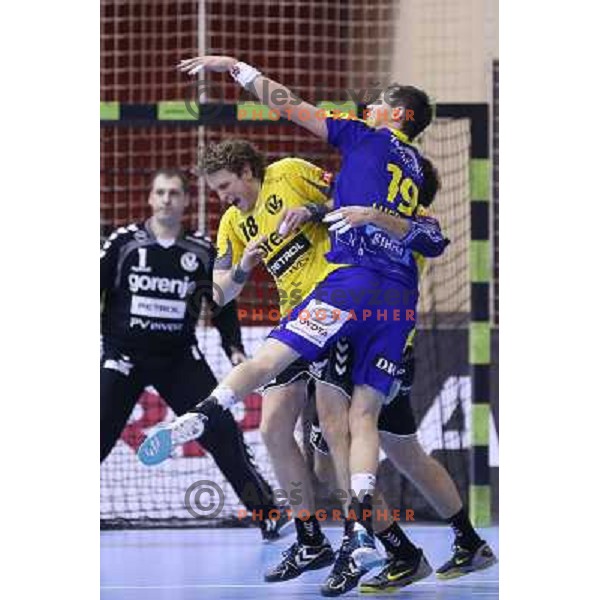 David Miklavcic of RK Gorenje Velenje and Krzystof Lijewski in action during handball match RK Gorenje Velenje-SK Vive Targi Kielce in EHF Velux Champions league, played in Red Hall, Velenje, Slovenia on February 23, 2013 