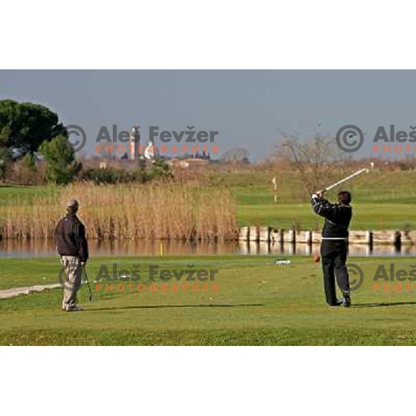 Teeing off at first hole at Grado golf course, Italy