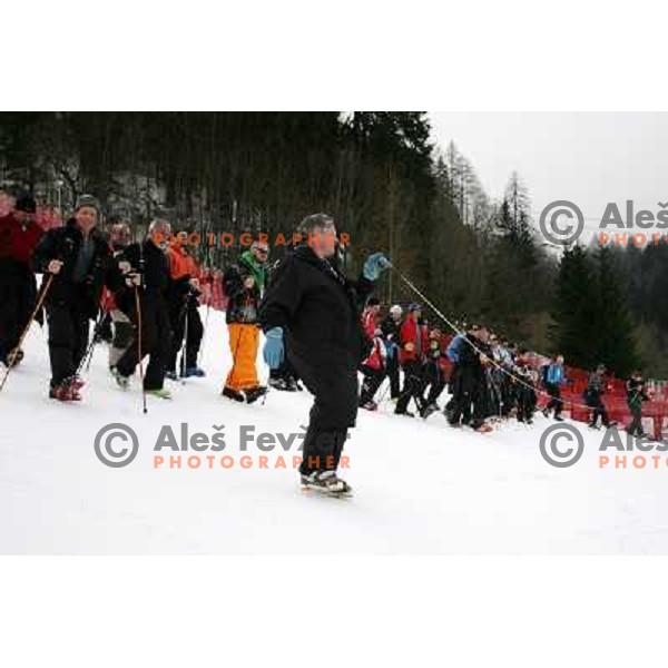 Hans Pieren (FIS) and volunteers of Vitranc World Cup races during final day of preparation of the course in Kranjska Gora, Slovenia on March 8 ,2013 