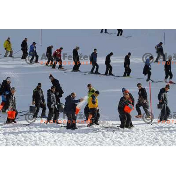 Volunteers of Vitranc World Cup races during final day of preparation of the slope in Kranjska Gora, Slovenia on March 8 ,2013 