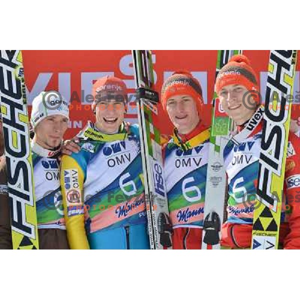 Robert Kranjec, Andraz Pograjc, Peter Prevc and Jurihj Tepes of Slovenia during team competition at FIS Ski jumping World Cup Final in Planica, Slovenia on March 23, 2013 