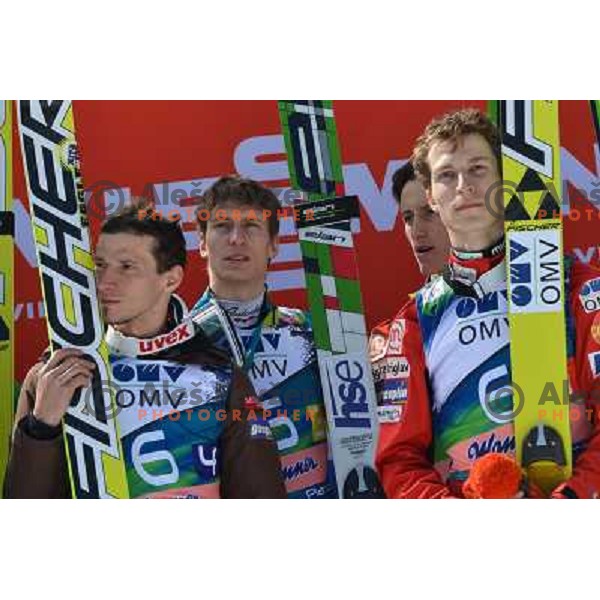 Robert Kranjec, Andraz Pograjc, Peter Prevc and Jurij Tepes of Slovenia during team competition at FIS Ski jumping World Cup Final in Planica, Slovenia on March 23, 2013 