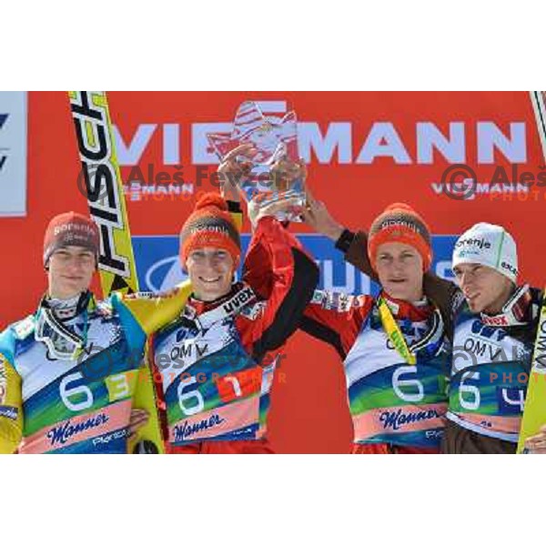 Andraz Pograjc, Jurij Tepes, Peter Prevc and Robert Kranjec of Slovenia during team competition at FIS Ski jumping World Cup Final in Planica, Slovenia on March 23, 2013 
