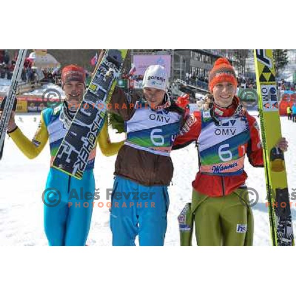 Andraz Pograjc, Robert Kranjec and Jurij Tepes of Slovenia during team competition at FIS Ski jumping World Cup Final in Planica, Slovenia on March 23, 2013 