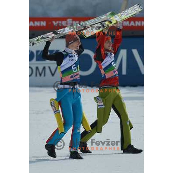 Andraz Pograjc and Jurij Tepes of Slovenia during team competition at FIS Ski jumping World Cup Final in Planica, Slovenia on March 23, 2013 