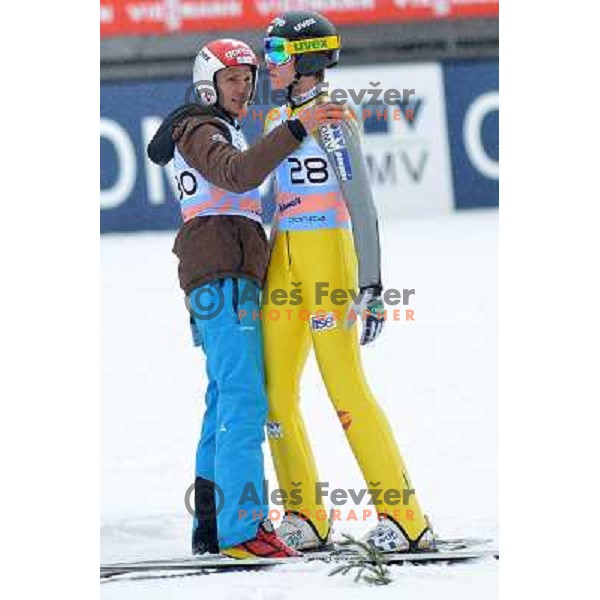 Robert Kranjec and Peter Prevc of Slovenia during final competition at FIS Ski jumping World Cup Final in Planica, Slovenia on March 24, 2013 