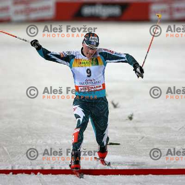 Manninen crossing finish line as new world champion at Nordic combined 7.5km Sprint race at FIS Nordic World SKI Championships 2007 in Sapporo, Japan