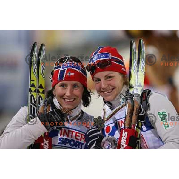 Bjoergen (left) and Jacobsen at Women\'s Sprint Relay race at FIS Nordic World SKI Championships 2007 in Sapporo, Japan