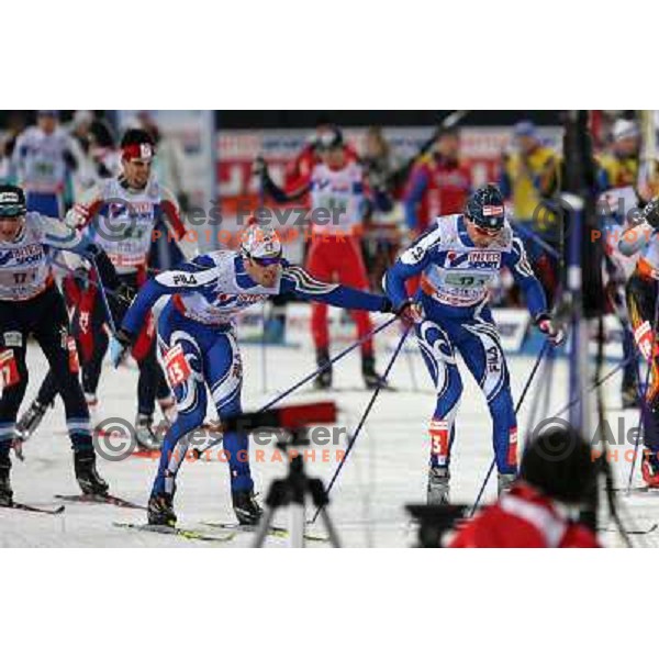 Pasini passing to Zorzi at Men\'s Sprint Relay race at FIS Nordic World SKI Championships 2007 in Sapporo, Japan