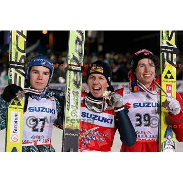 Harri (silver) Ammann (gold) and Ljoekelsoey (bronze) pose with medals after Ski-jumping competition at Large Hill Okurayama (HS 134) at FIS Nordic World SKI Championships 2007 in Sapporo, Japan