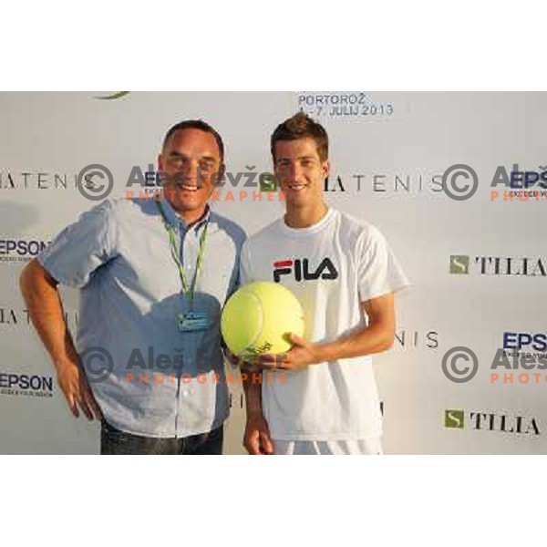 Gasper Bolhar and Aljaz Bedene in players corner after victory in first round of Tilia Slovenia Open-ATP Challenger Tour in Portoroz, Slovenia on July 2, 2013 