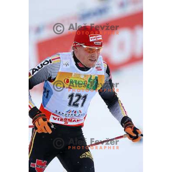 Tobias Angerer of Germany racing in snow storm at Cross Country 15 km individual race at FIS Nordic Ski WC Sapporo, Japan